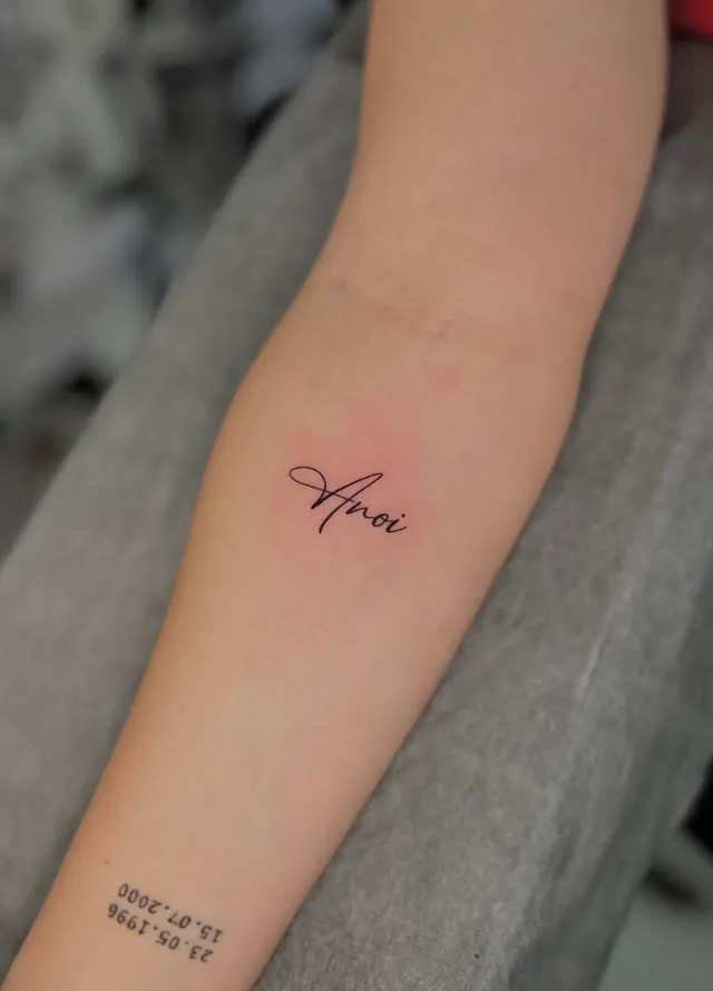 Minimal script with dates on the forearm